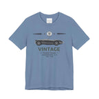 Light blue t-shirt with vintage car graphic and text on a white background.