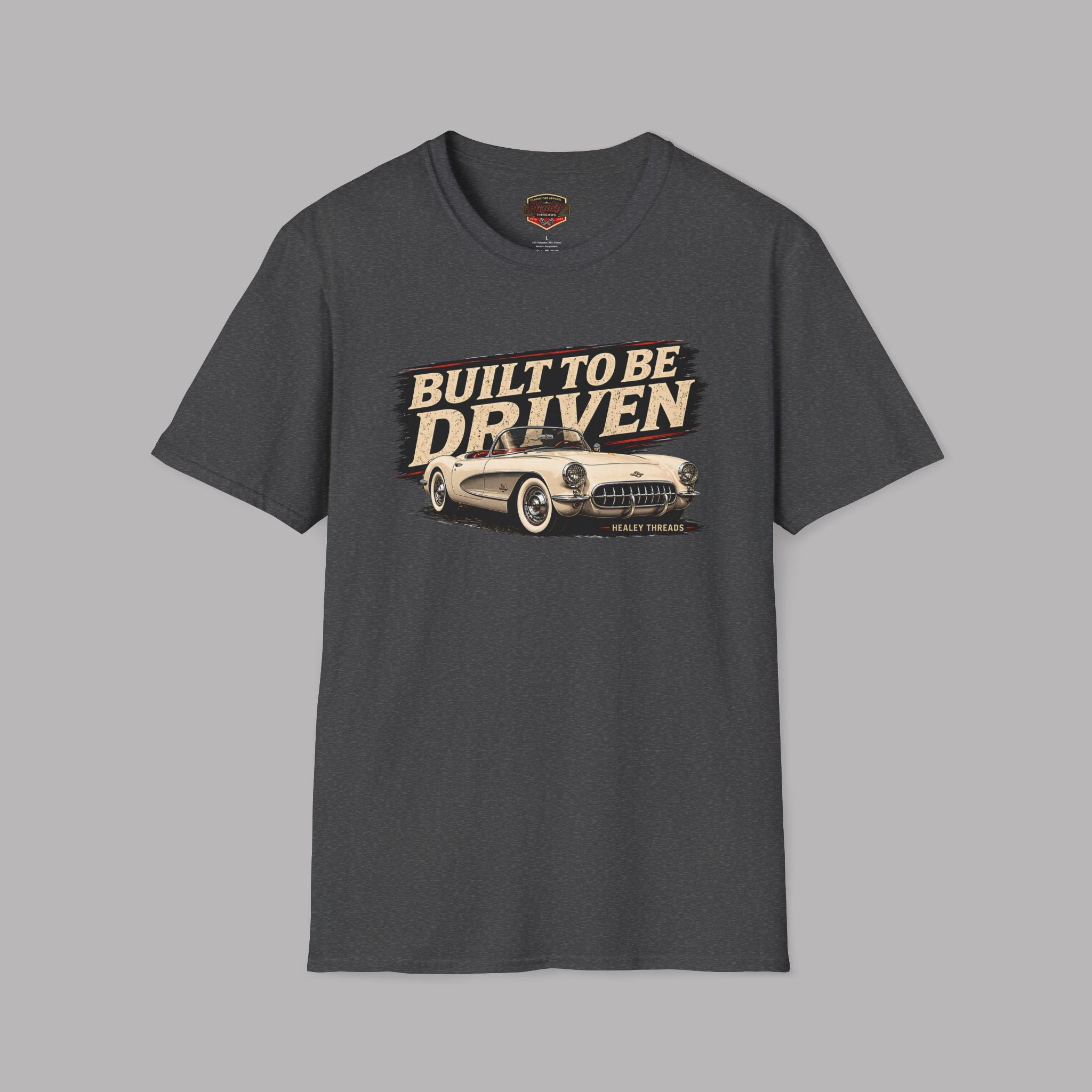 Dark heather t-shirt with 'Built to be Driven' graphic on a gray background