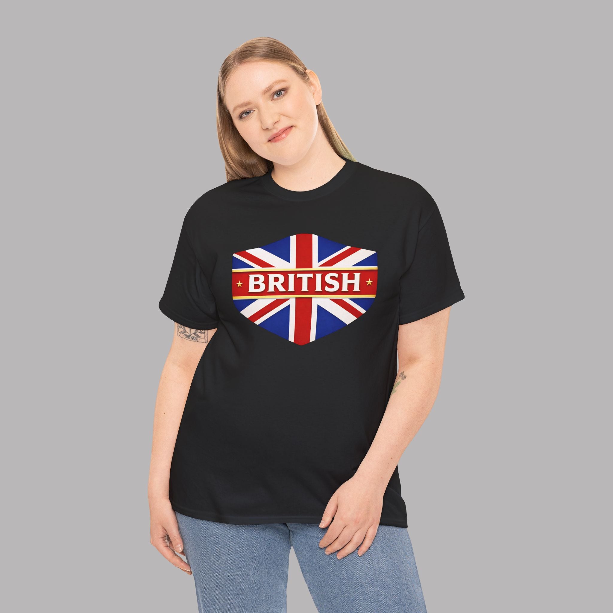 Woman wearing a black t-shirt with a Union Jack design and 'BRITISH' text on a gray background