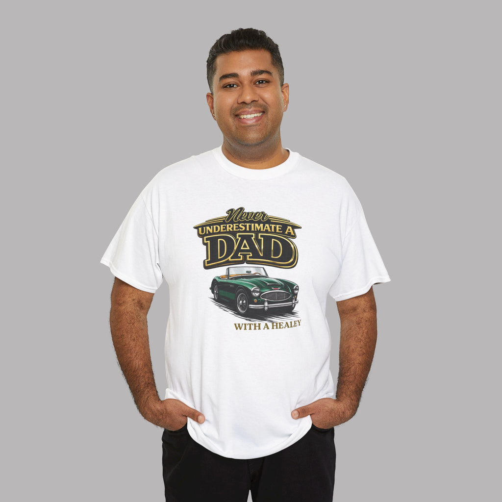 Man wearing a white t-shirt with a classic car graphic design and text on a gray background