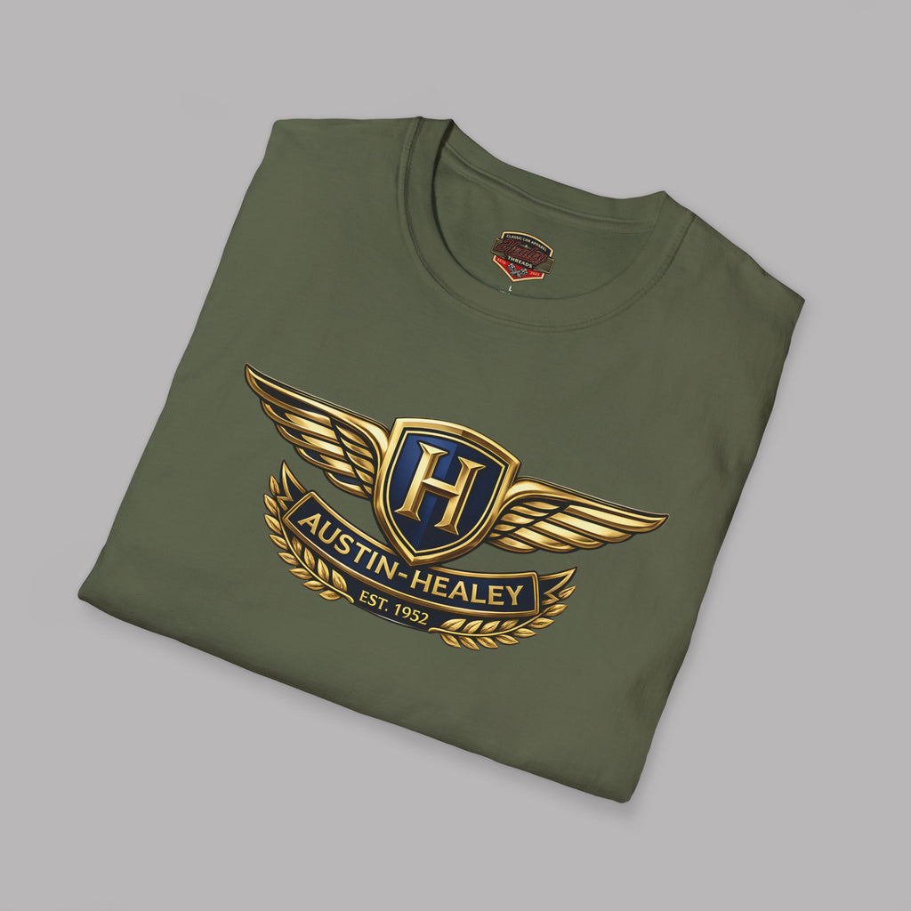 Folded military green t-shirt with an Austin Healey logo on a gray background.