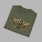 Folded military green t-shirt with an Austin Healey logo on a gray background.