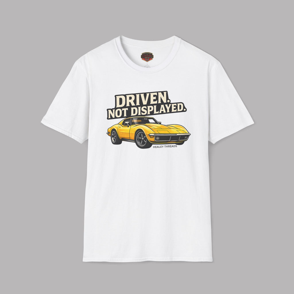 White t-shirt with a yellow muscle car graphic and text on a gray background