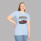 Woman wearing a light blue t-shirt with a graphic and text 'No Garage Queens' on a gray background