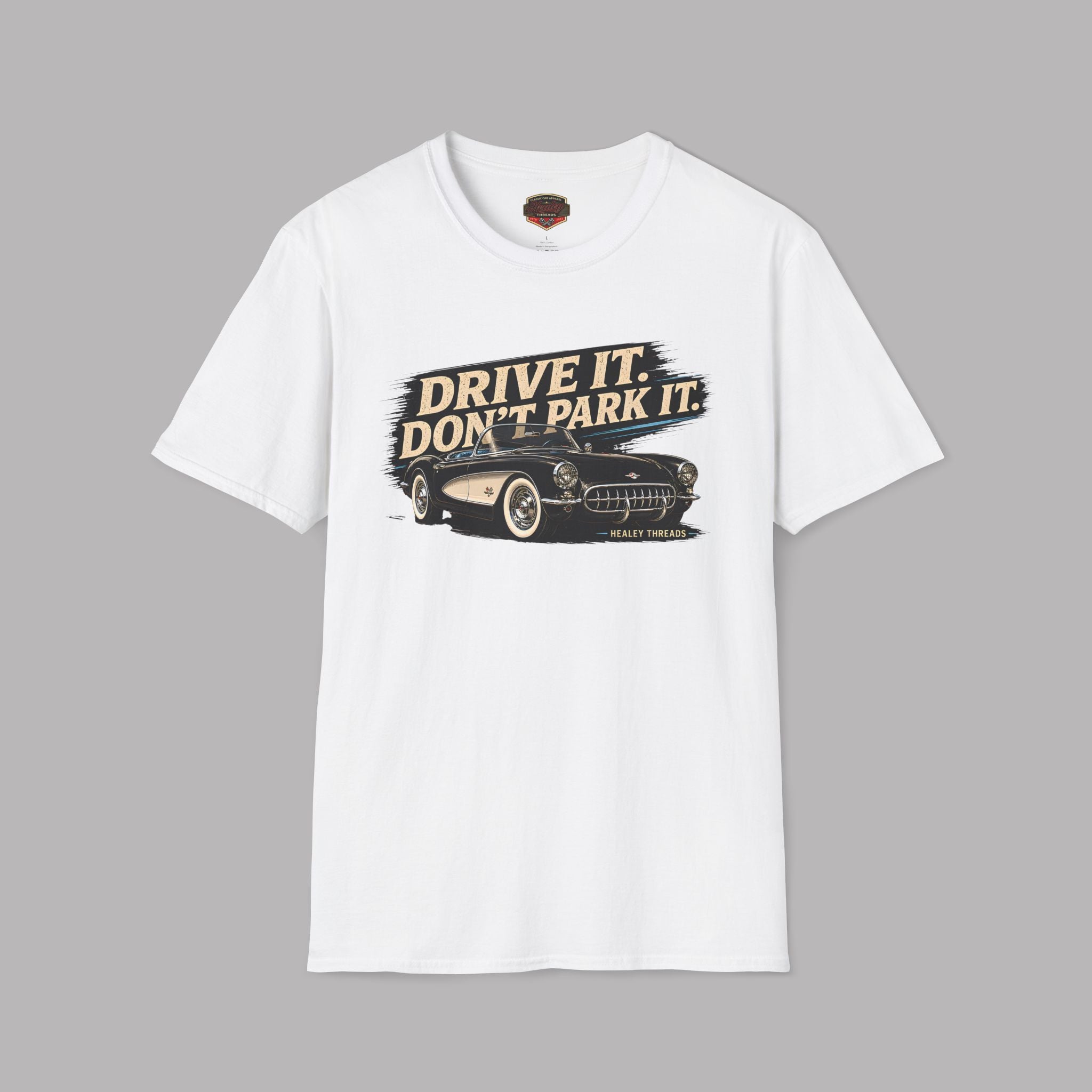 White t-shirt with a vintage graphic car design and text on a gray background