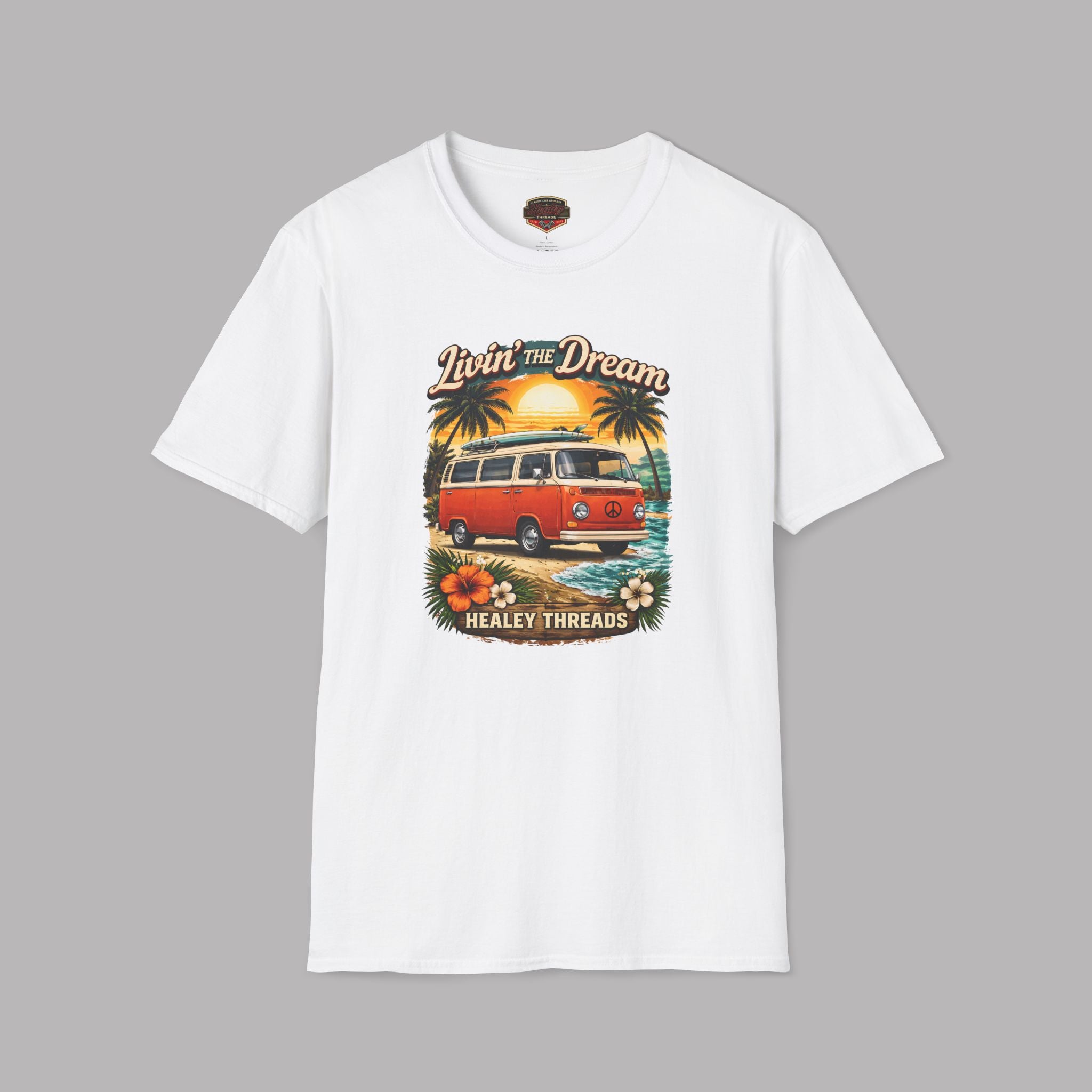 White t-shirt with a graphic of a van and sunset on a gray background