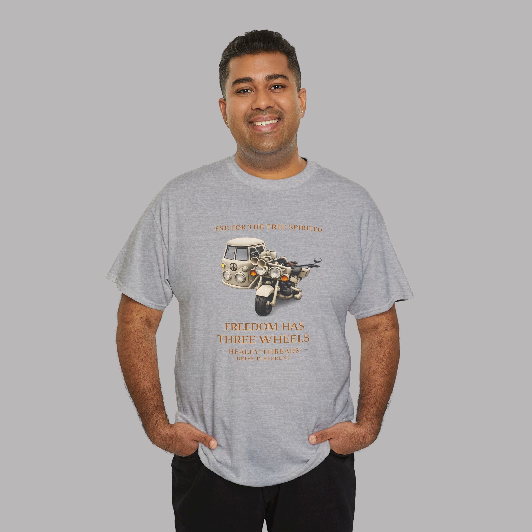 Man wearing a gray t-shirt with a motorcycle graphic and text on a gray background