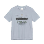 Light blue t-shirt with vintage car graphic and text on a white background