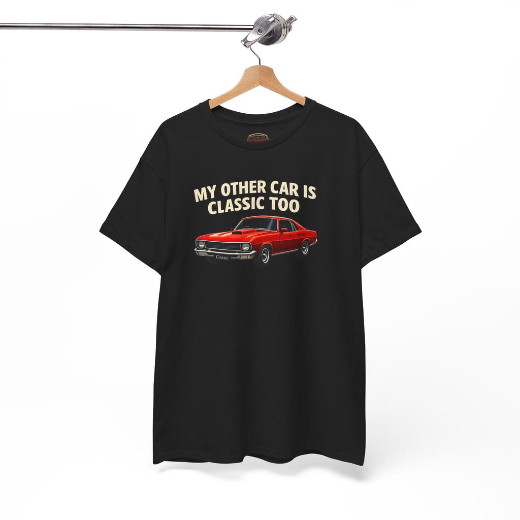 Black t-shirt with red car graphic and text 'My other car is classic too' on a hanger against a white background