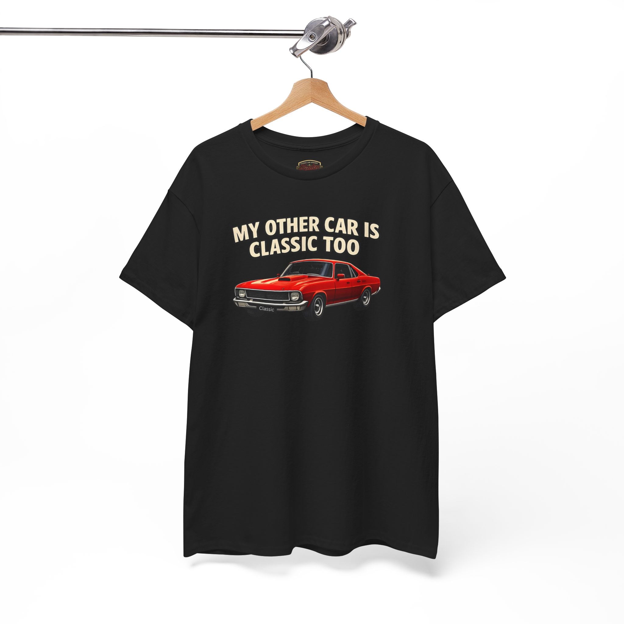 Black t-shirt with red car graphic and text 'My other car is classic too' on a hanger against a white background