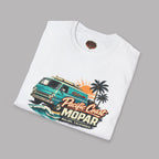 Folded white t-shirt with a colorful graphic van design on a gray background