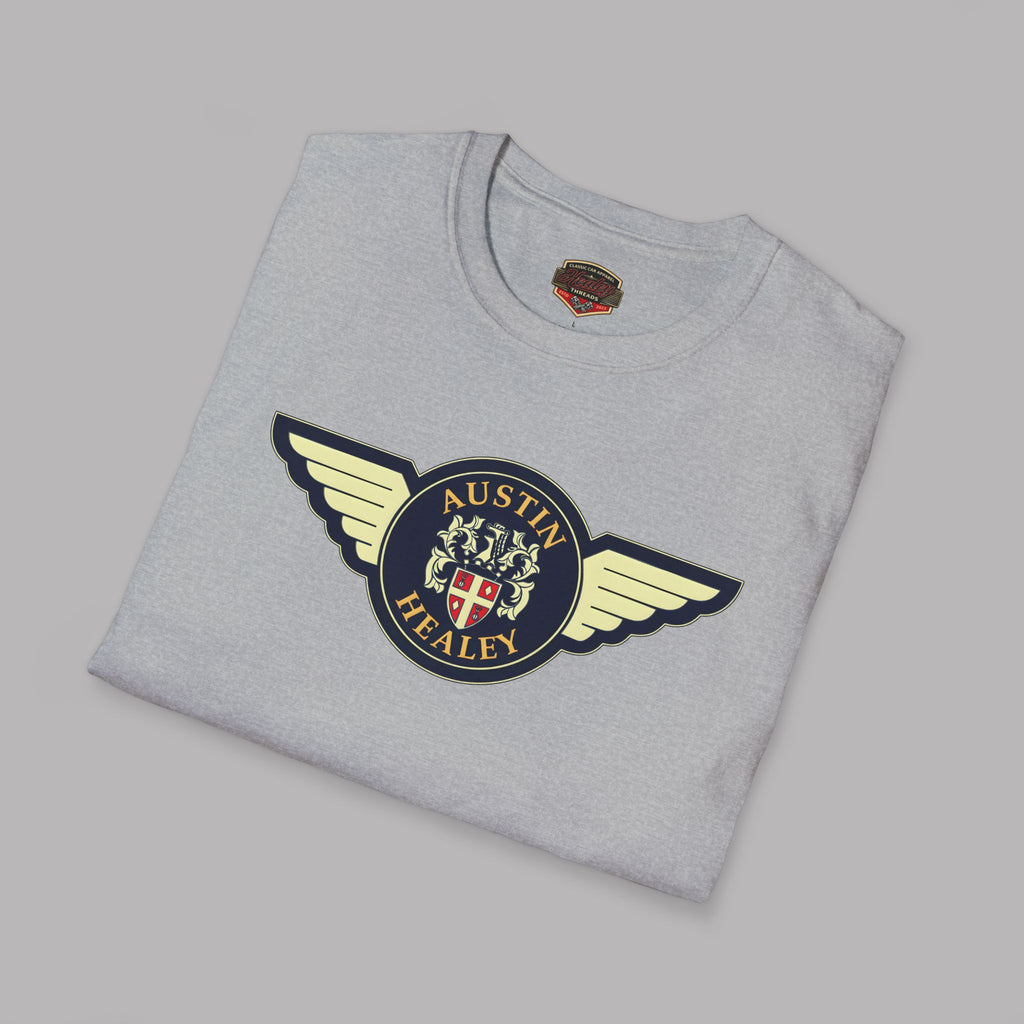Folded gray t-shirt with Austin Healey logo on a gray background