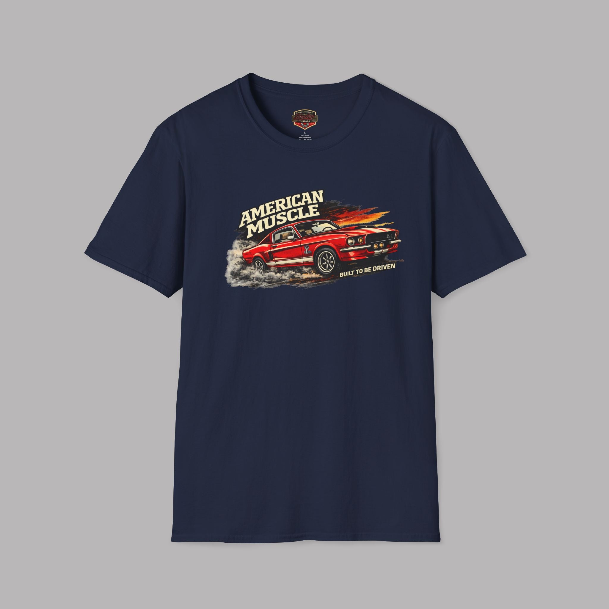Navy blue t-shirt with red muscle car graphic and 'American Muscle' text on a gray background