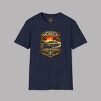Navy blue t-shirt with a graphic design of a car and sunset on a gray background