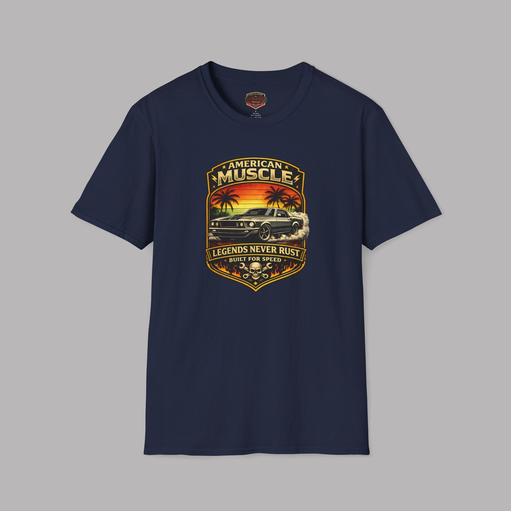 Navy blue t-shirt with a graphic design of a car and sunset on a gray background