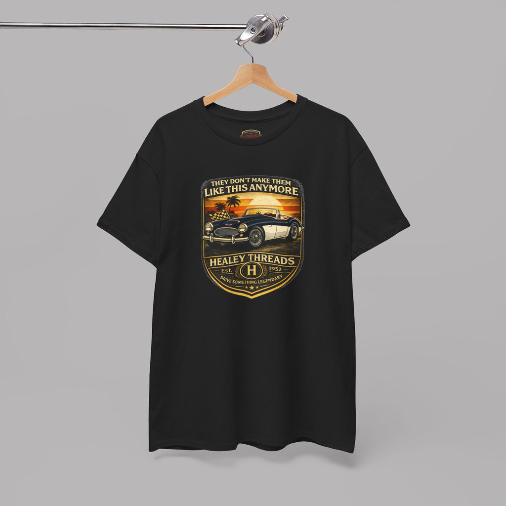 Black t-shirt with a graphic car design on a hanger against a gray background
