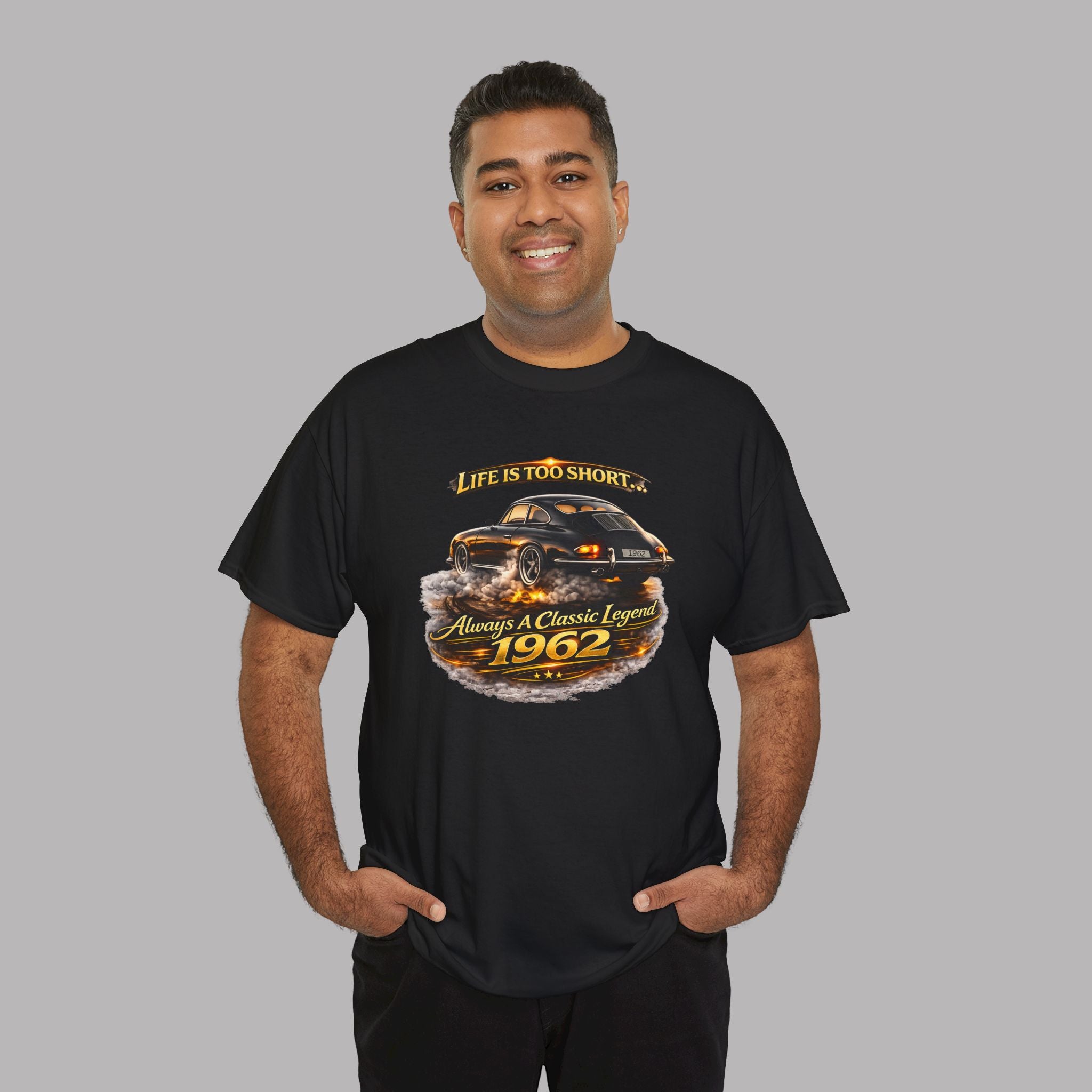 Man wearing a black t-shirt with a classic car graphic design on a gray background