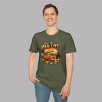Man wearing a military green t-shirt with 'Van Life' graphic design on a gray background