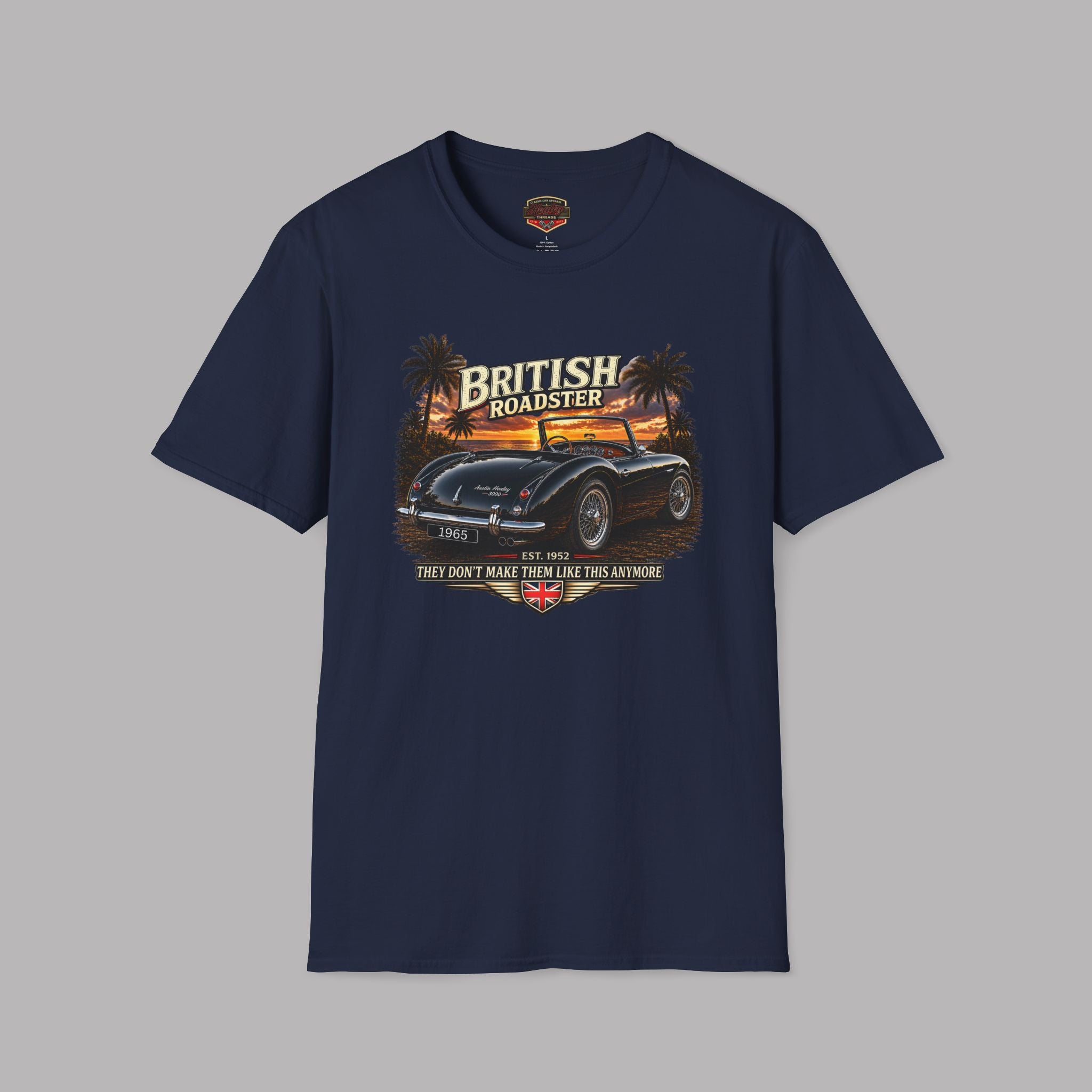 Navy blue t-shirt with a vintage car graphic and 'British Roadster' text on a gray background