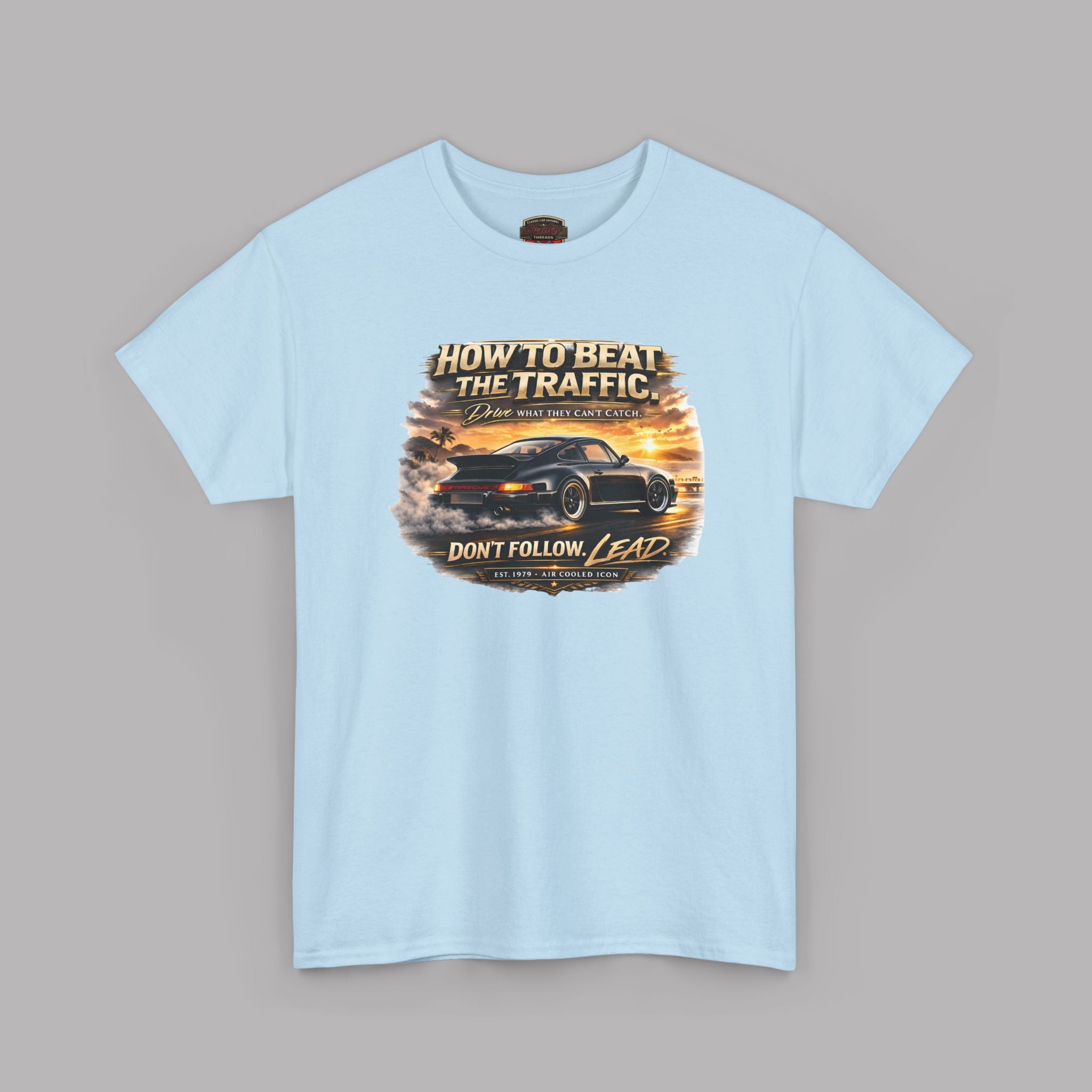 Light blue t-shirt with a classic car graphic design on a gray background