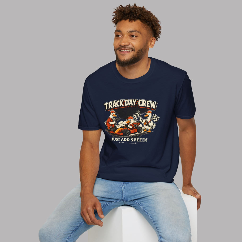 Man wearing a navy blue t-shirt with 'Track Day Crew' graphic design on a gray background