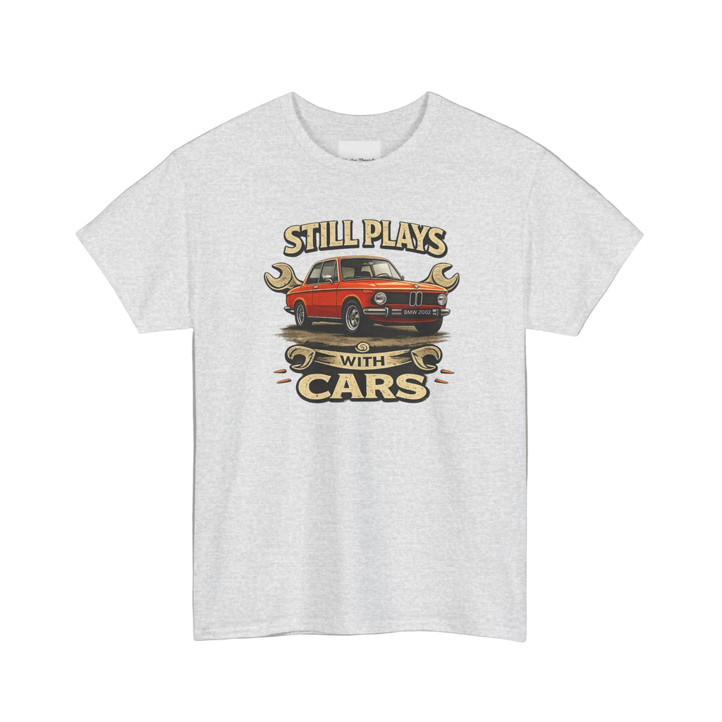 Ash t-shirt with a graphic of a red car and text 'Still Plays with Cars' on a white background