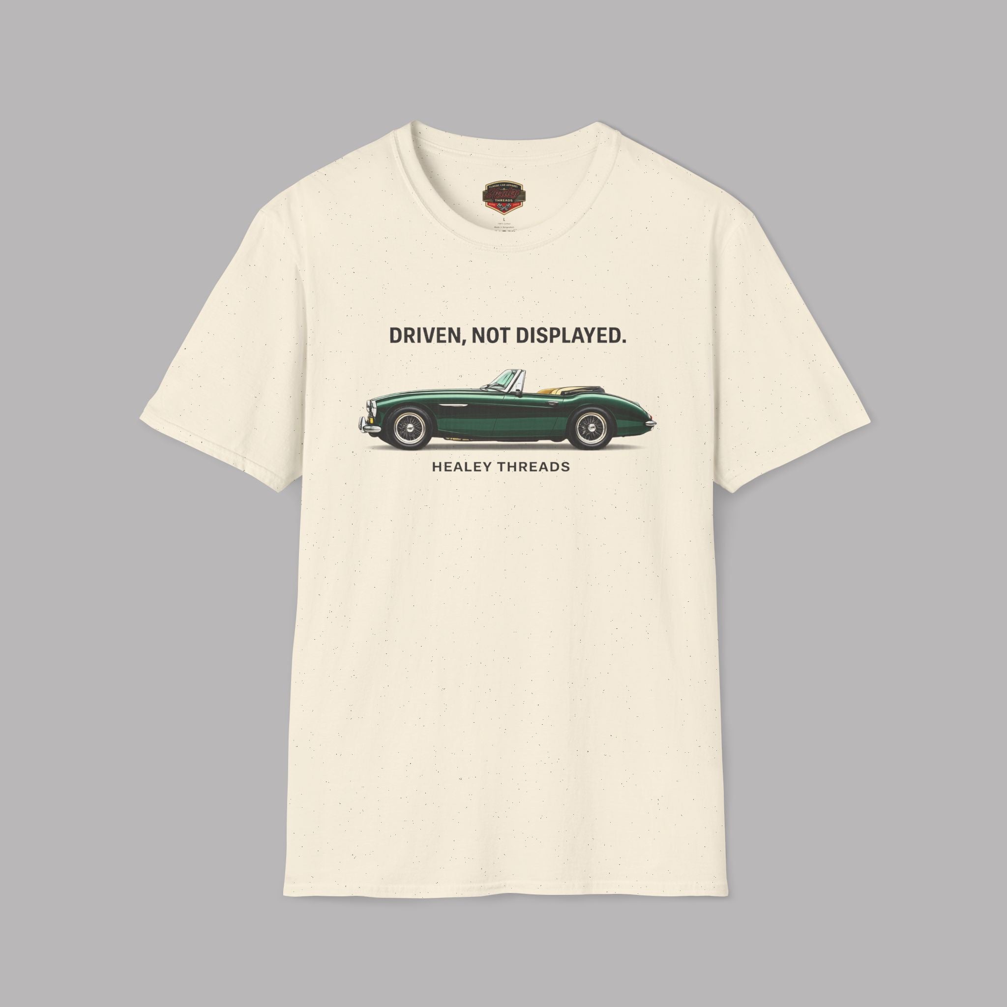 Natural t-shirt with a green classic car graphic and text on a gray background