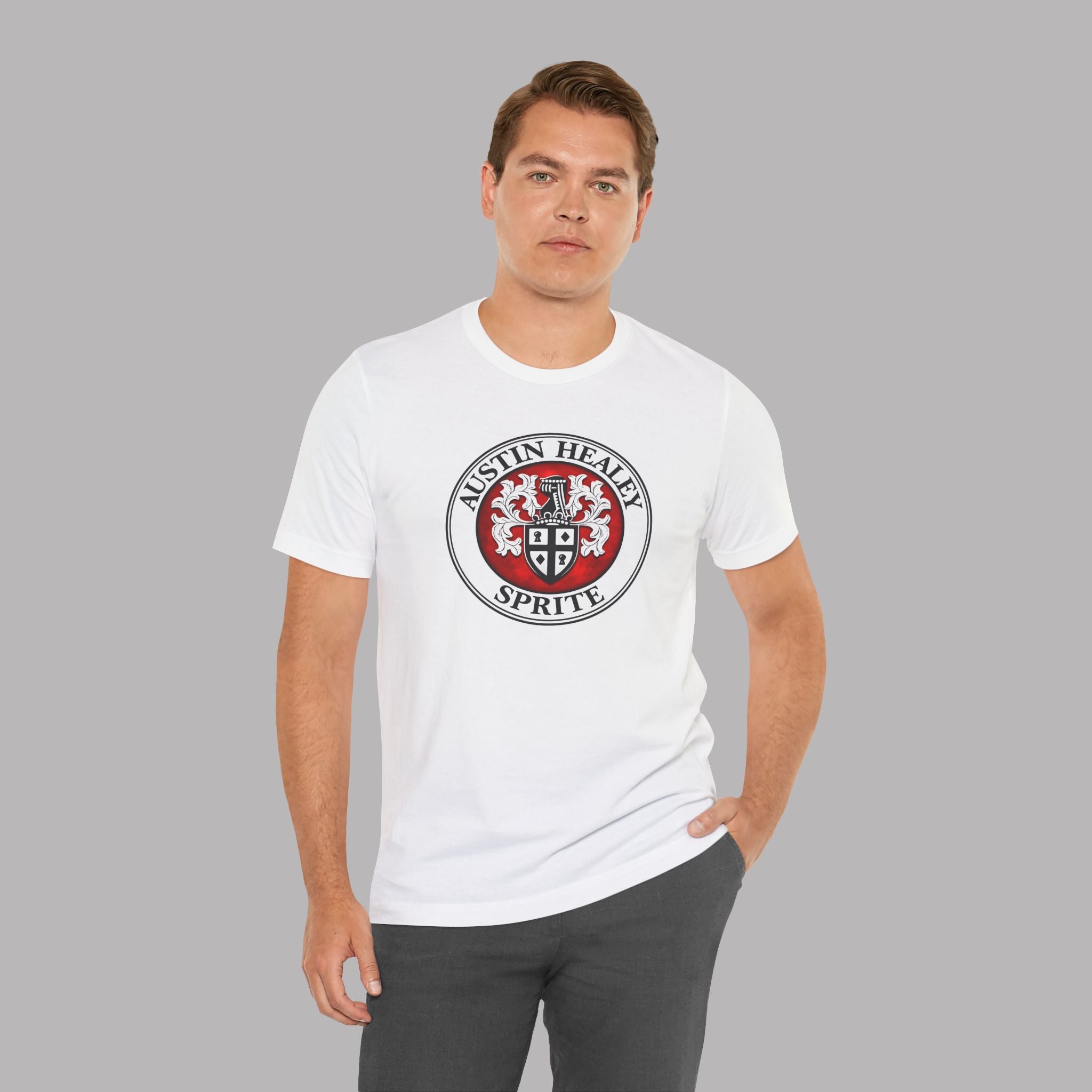 Man wearing a white t-shirt with a Austin Healey Sprite logo on a gray background