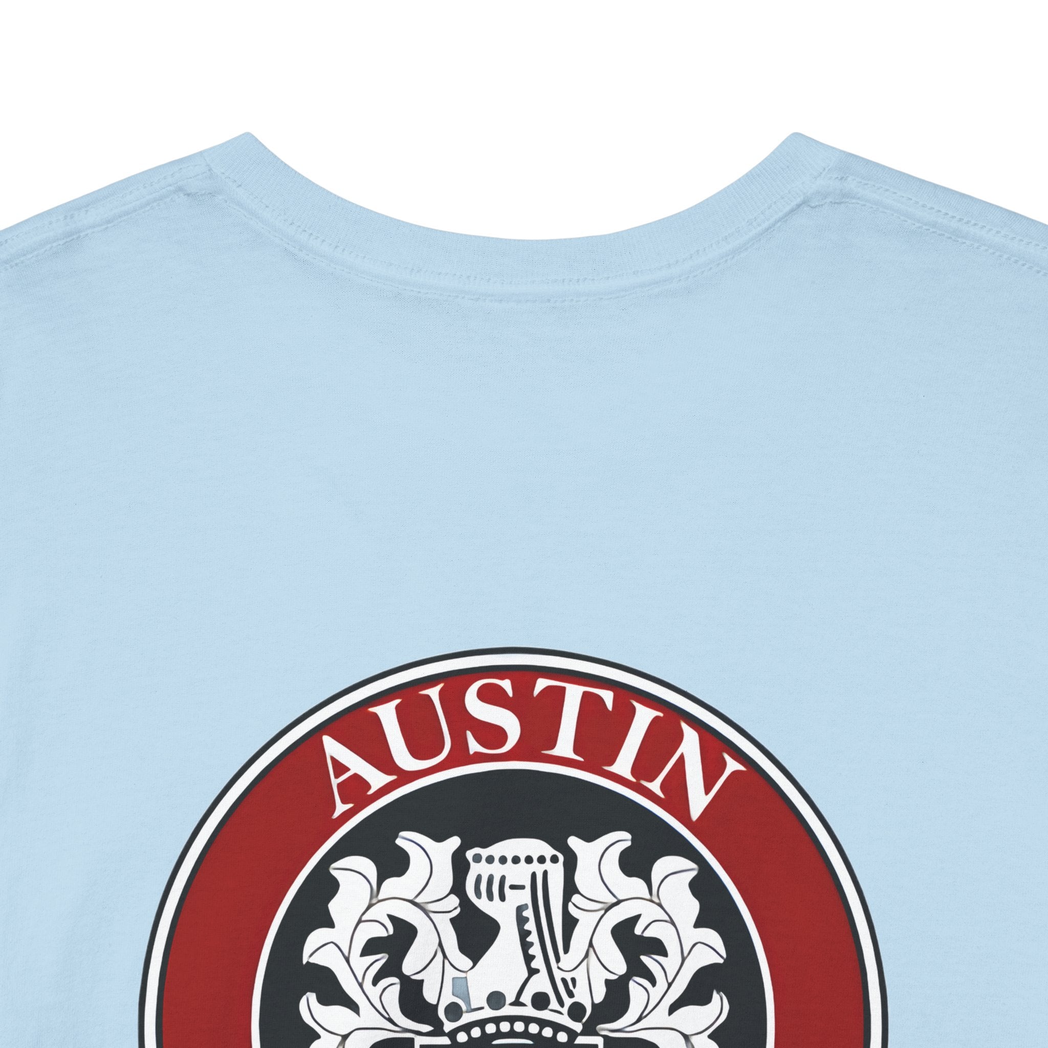 Light blue t-shirt with a red and black emblem featuring the word 'AUSTIN'.