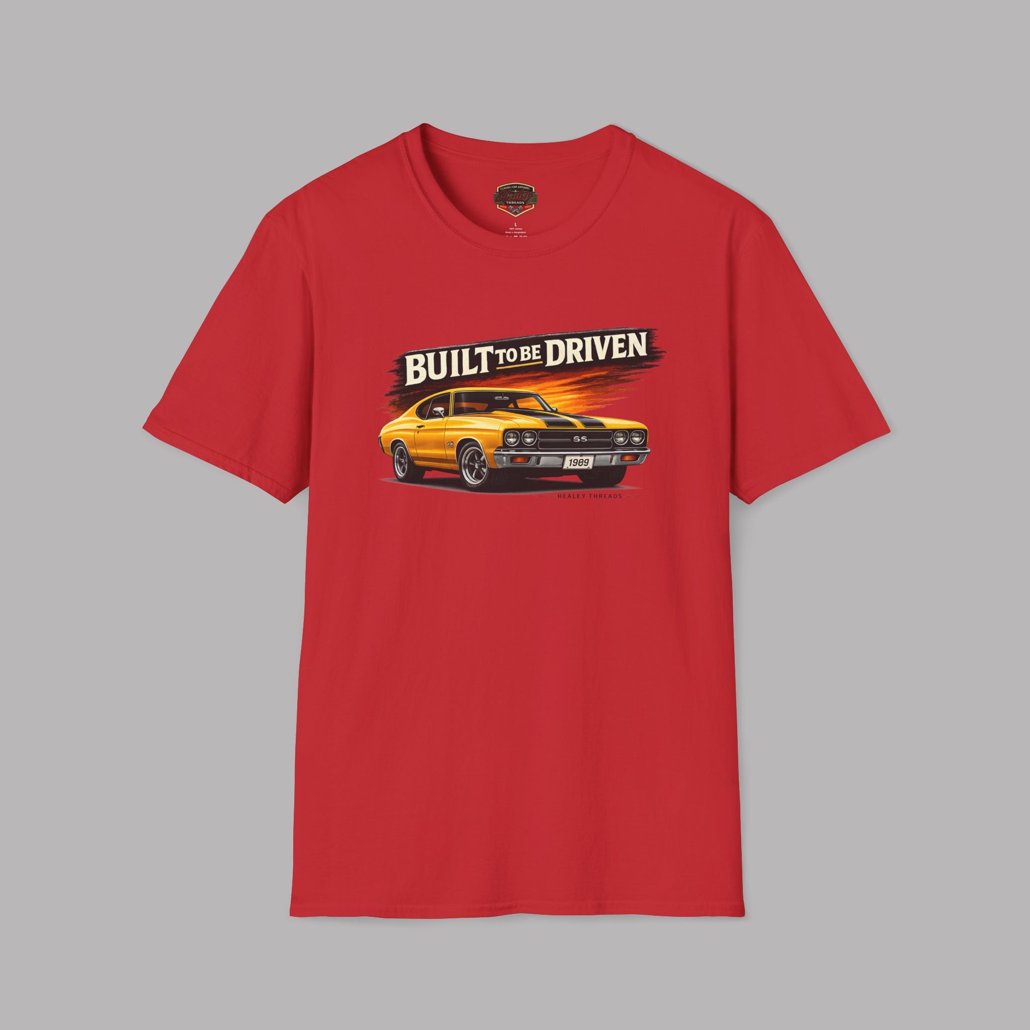 Red t-shirt with a graphic of a car and 'Built to be Driven' text on a gray background