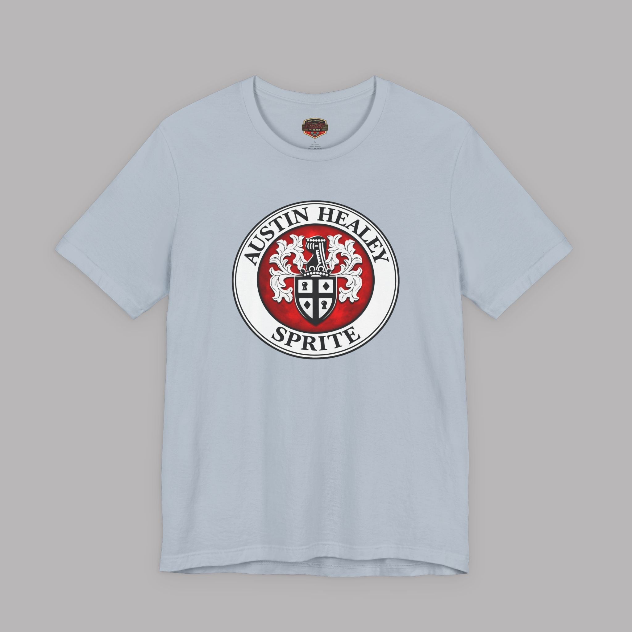 Light blue t-shirt with Austin Healey Sprite logo on a gray background