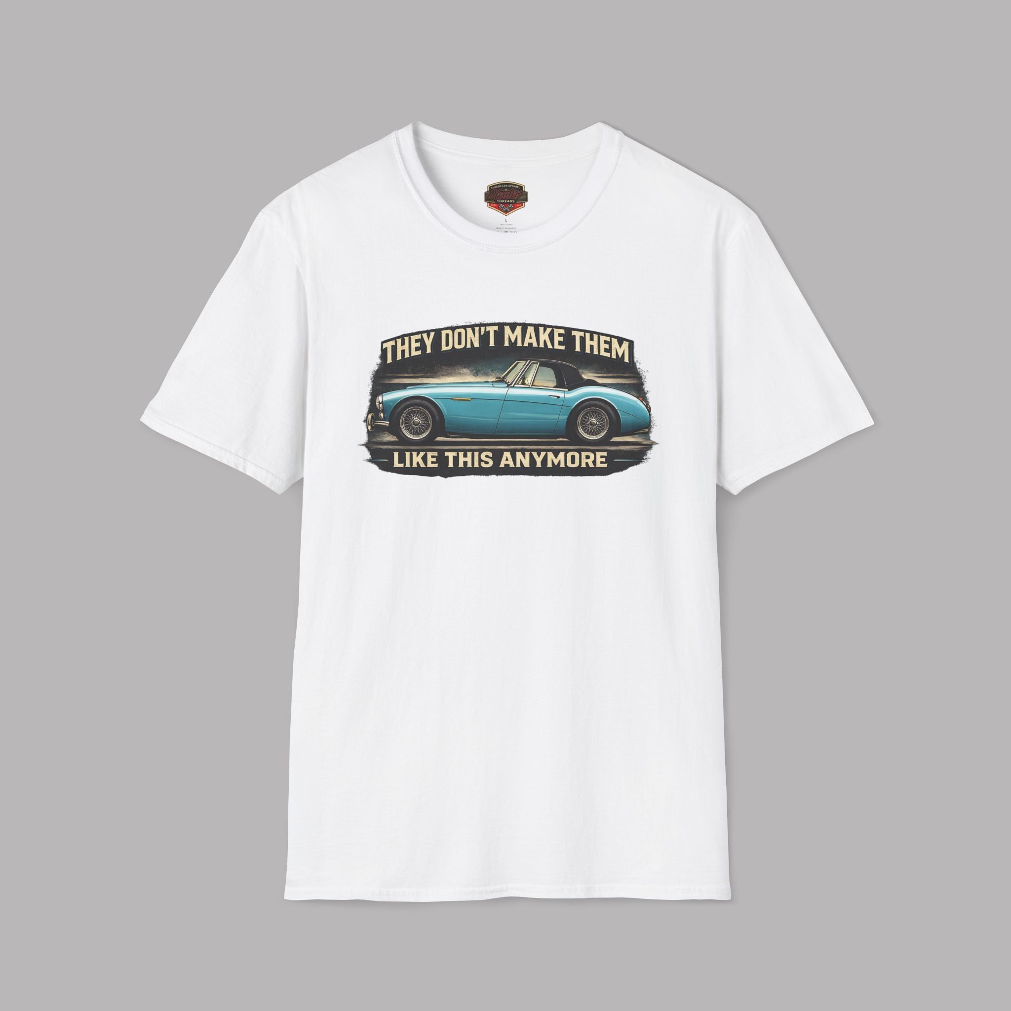 White t-shirt with vintage Healey car graphic and text on a gray background