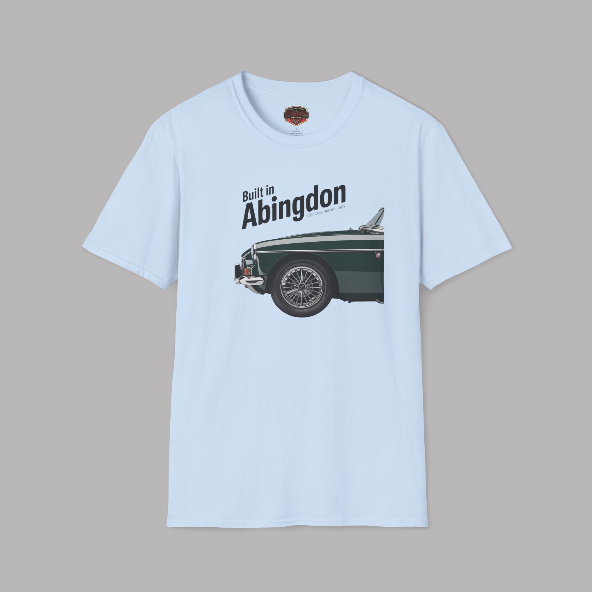 Light blue t-shirt with a graphic of a classic car and text 'Built in Abingdon' on a gray background
