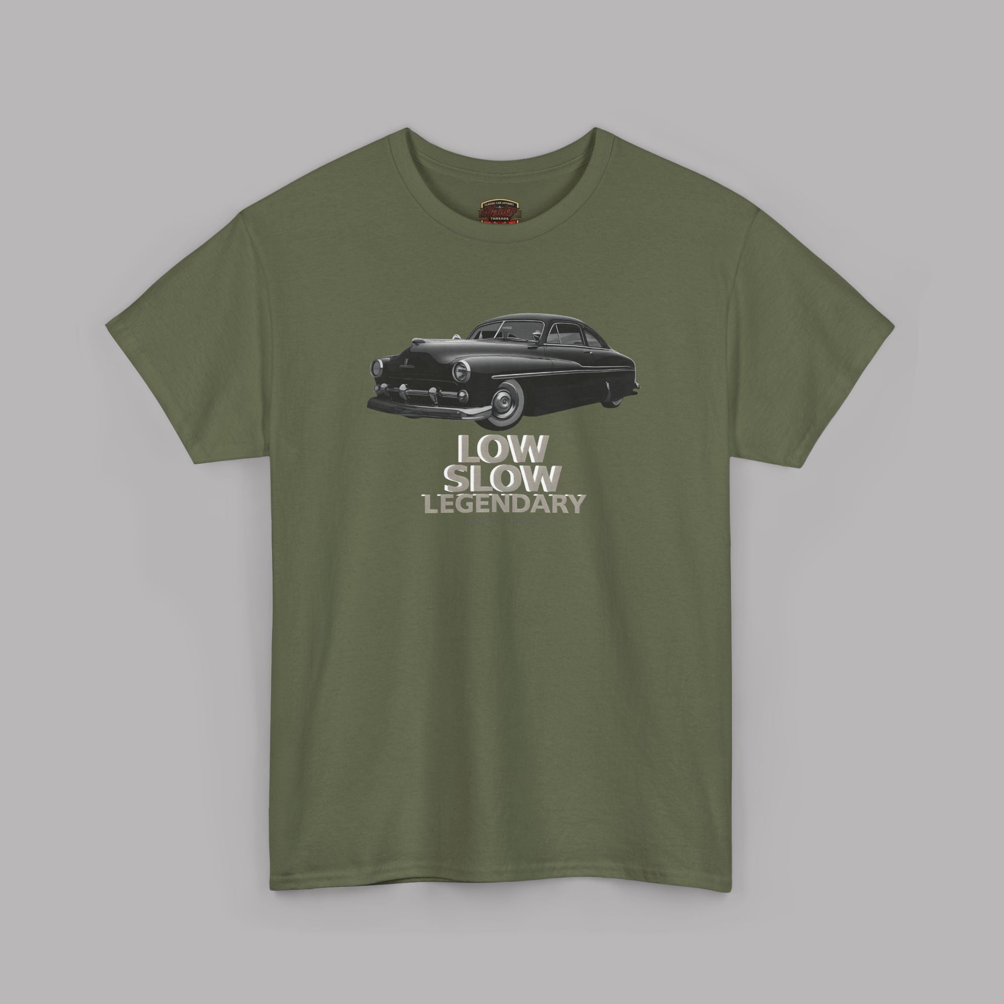 Military green t-shirt with a graphic of a classic car and text on a gray background