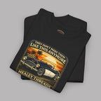 Folded black t-shirt with vintage car graphic and 'Healey Threads' branding on a gray background