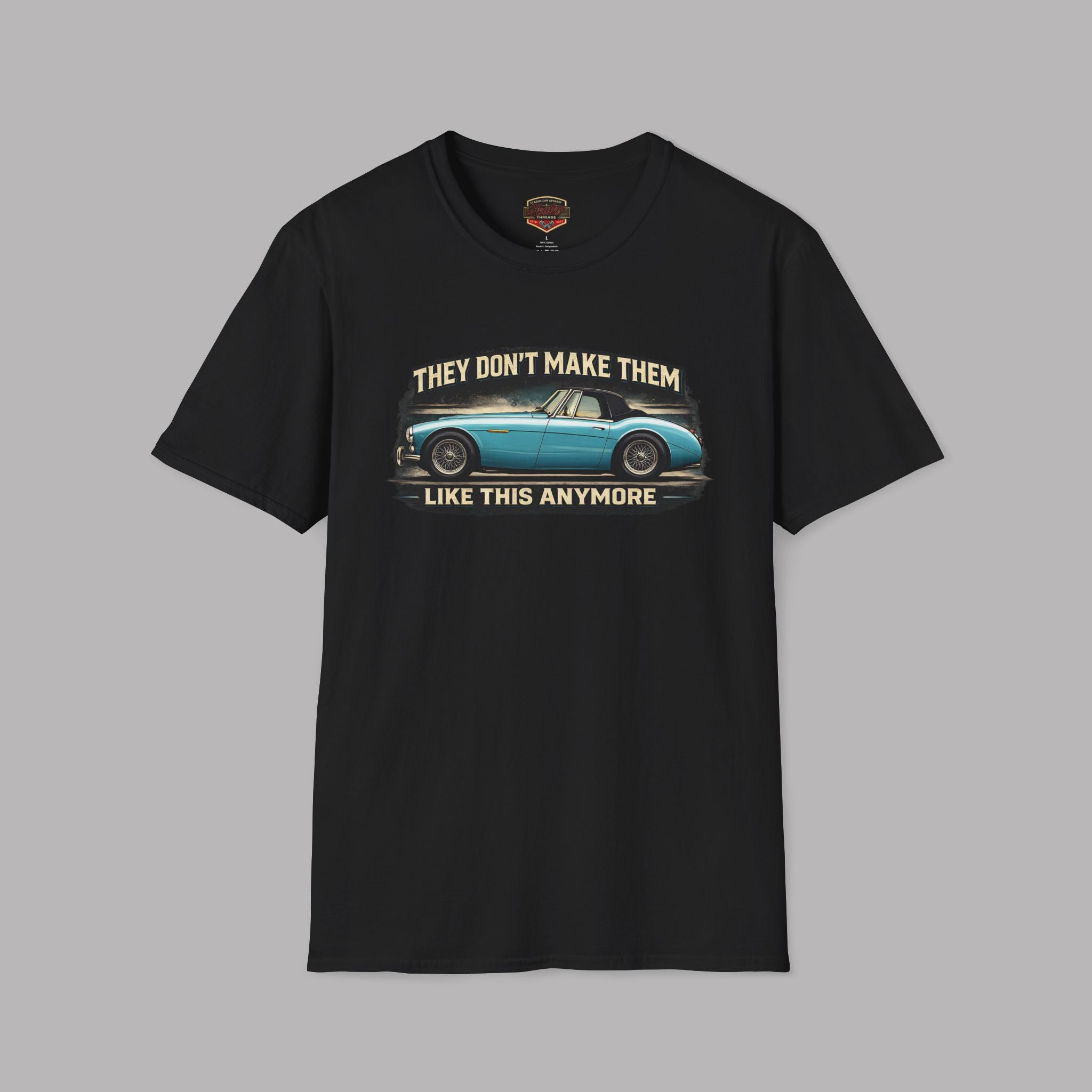 Black t-shirt with a graphic of a blue car and text on a gray background
