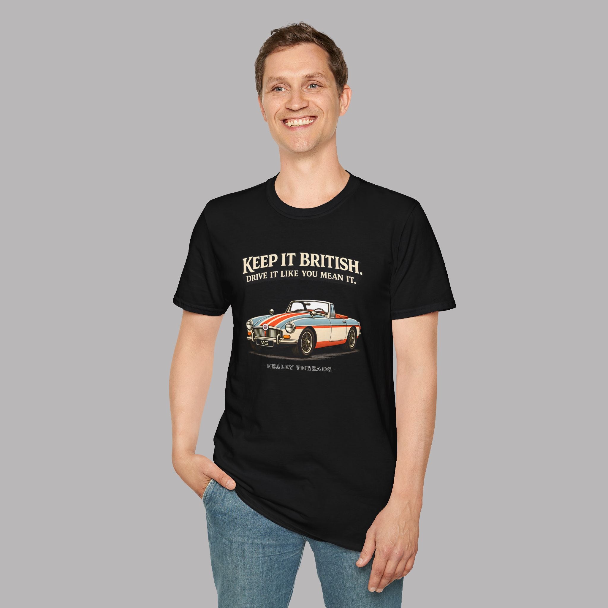 Man wearing a black t-shirt with a graphic MGB car and text on a gray background