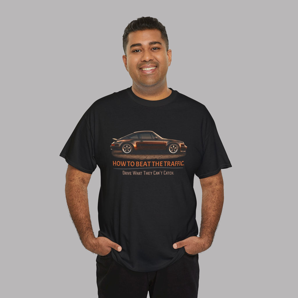 Man wearing a black t-shirt with a classic car graphic design and text on a gray background