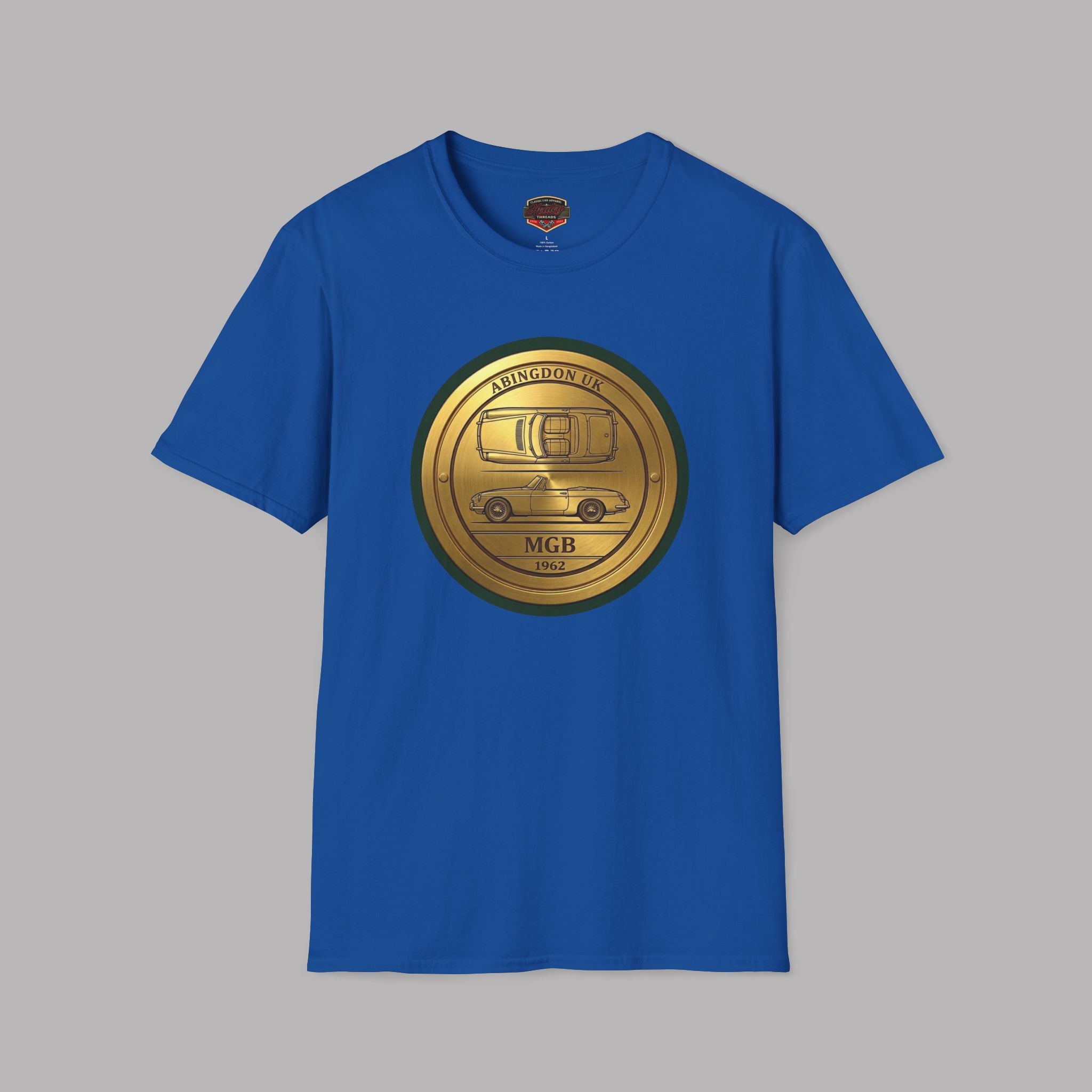 Royal blue t-shirt with a gold classic car emblem on a gray background