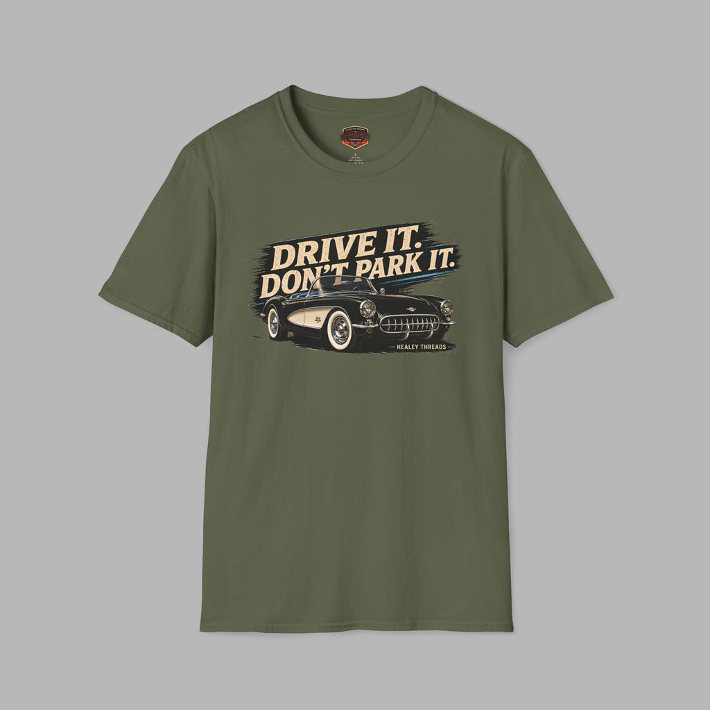 Military green t-shirt with a graphic of a car and text 'Drive it. Don't park it.' on a gray background