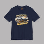 Navy blue t-shirt with a classic car graphic and text on a gray background