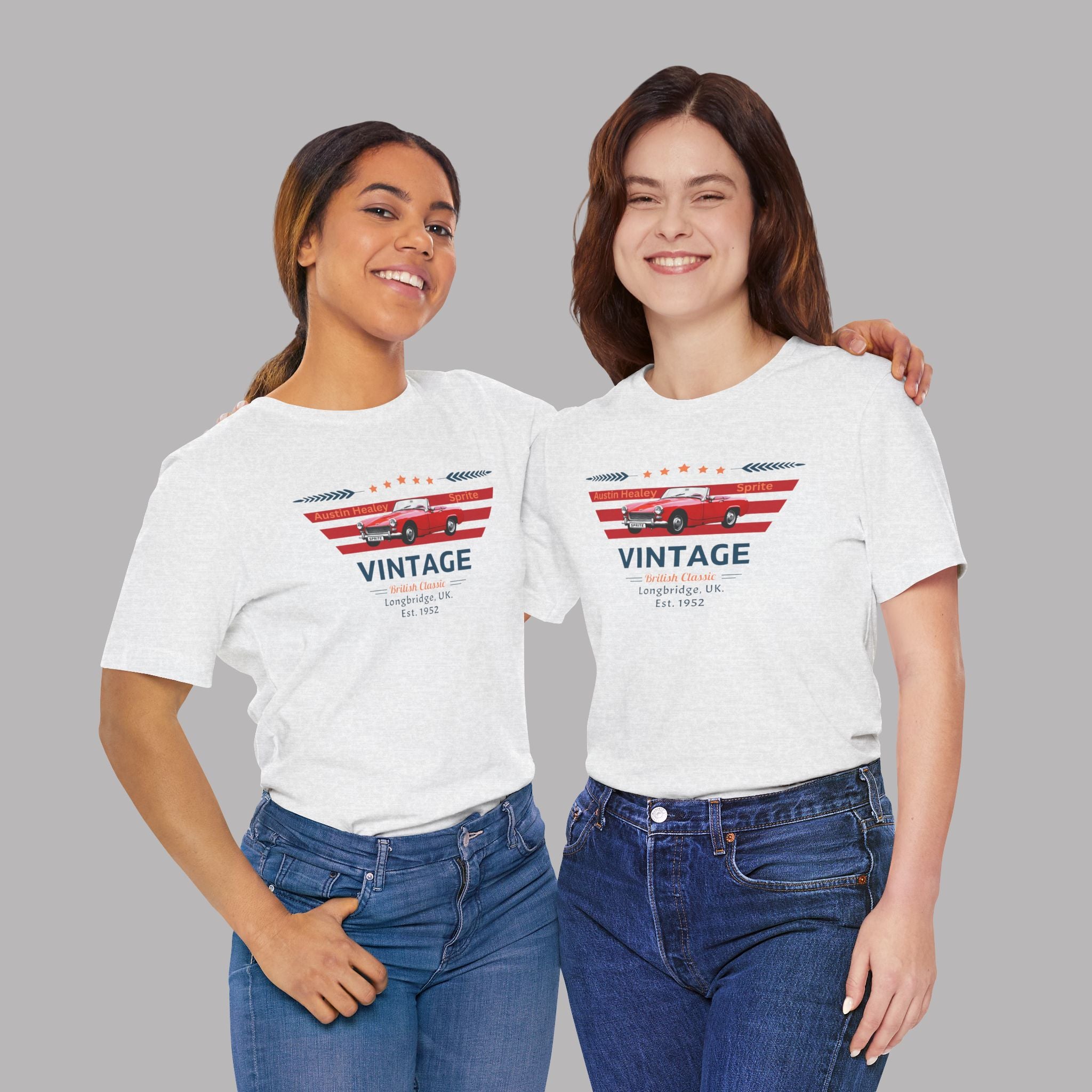 Two women wearing white t-shirts with a vintage car designs on a gray background