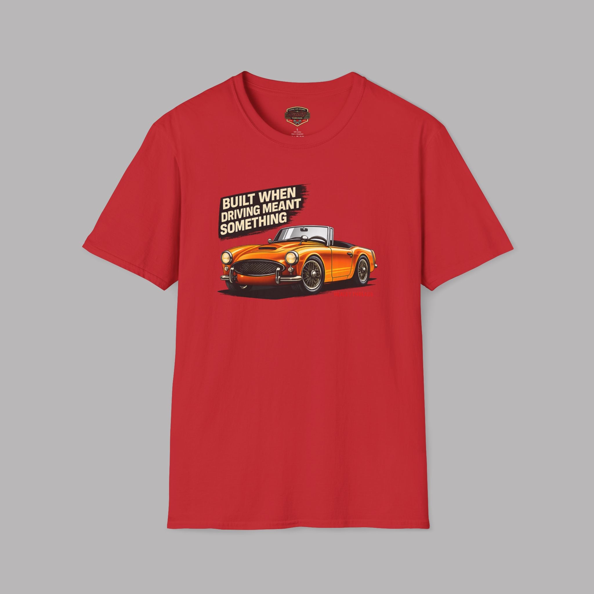 Red t-shirt with an orange car graphic and text on a gray background