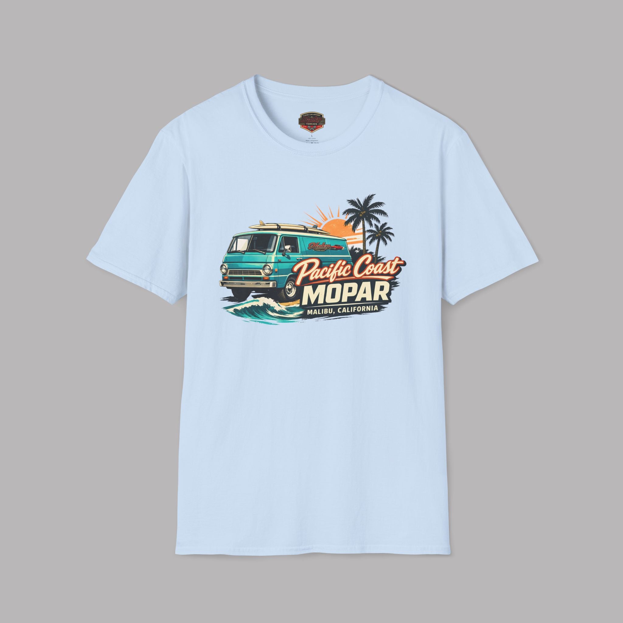 Light blue t-shirt with a graphic design of a van and text on a gray background
