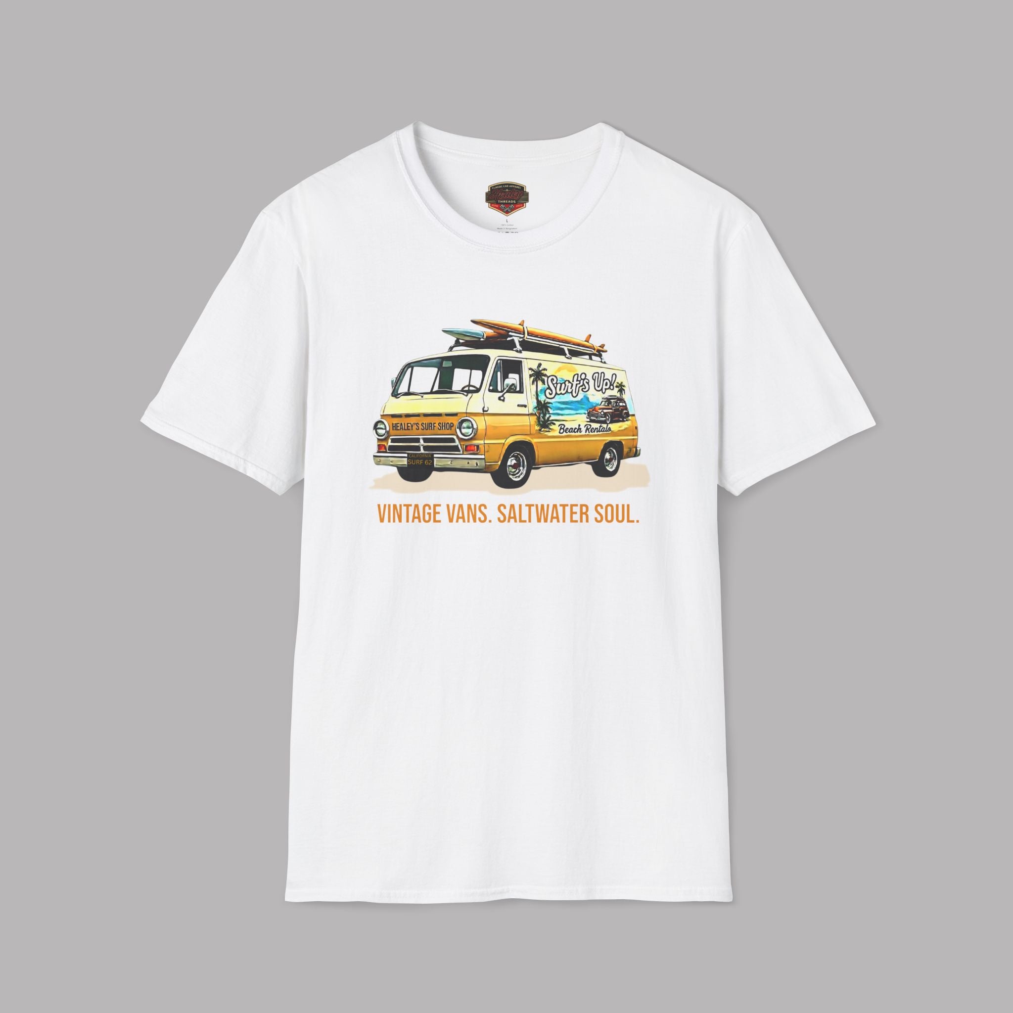 White t-shirt with a classic van and surfboard graphic on a gray background