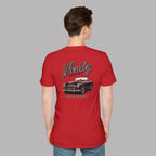 Man wearing a red t-shirt with a classic car design and 'Healey' branding on the back.
