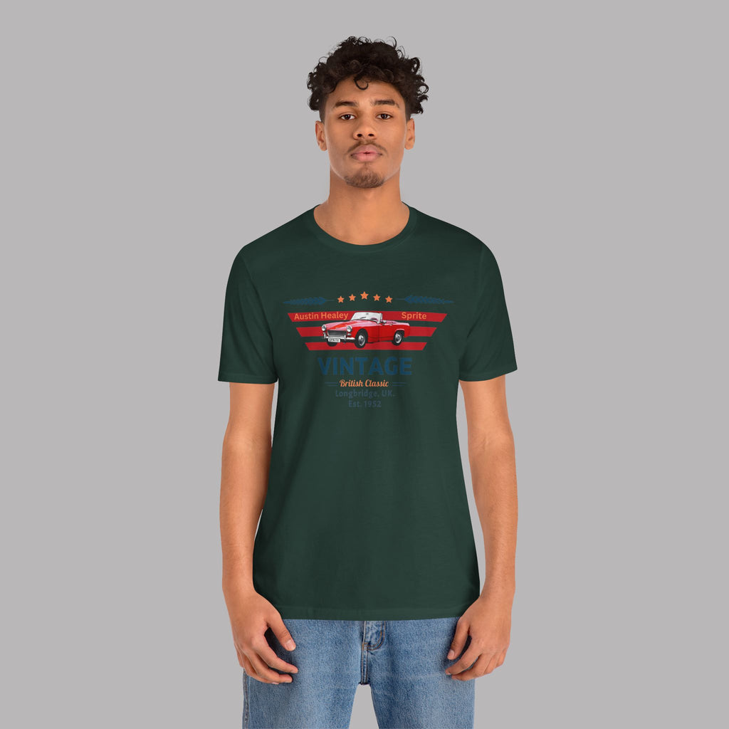 Man wearing a forest green t-shirt with a classic car graphic design on a gray background