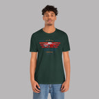 Man wearing a forest green t-shirt with a classic car graphic design on a gray background