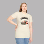 Woman wearing a cream t-shirt with a classic car graphic design and text on a gray background