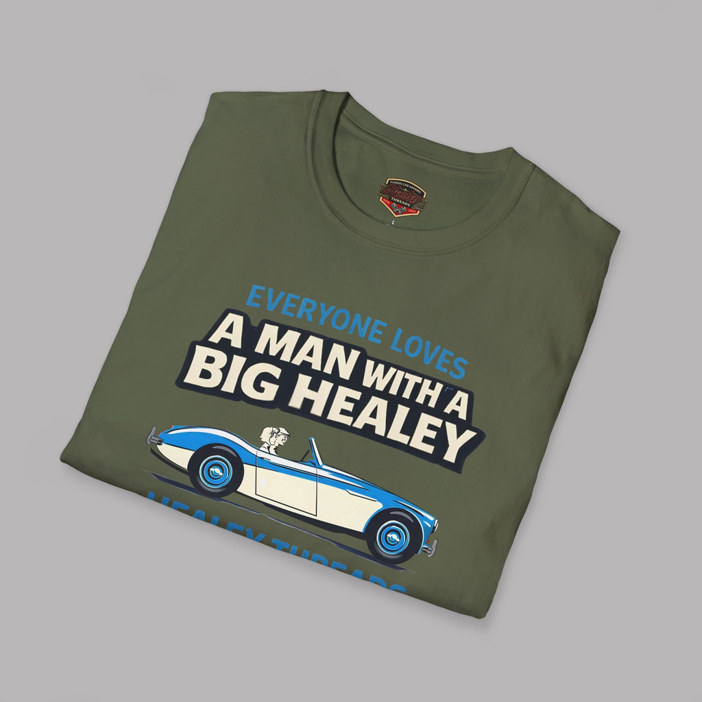 Folded military green t-shirt with Healey car graphic and text on a gray background